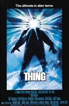 The Thing film poster, a hooded figure with light blazing from its face