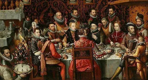 A Renaissance painting of a royal banquet, courtiers seated around a laden table